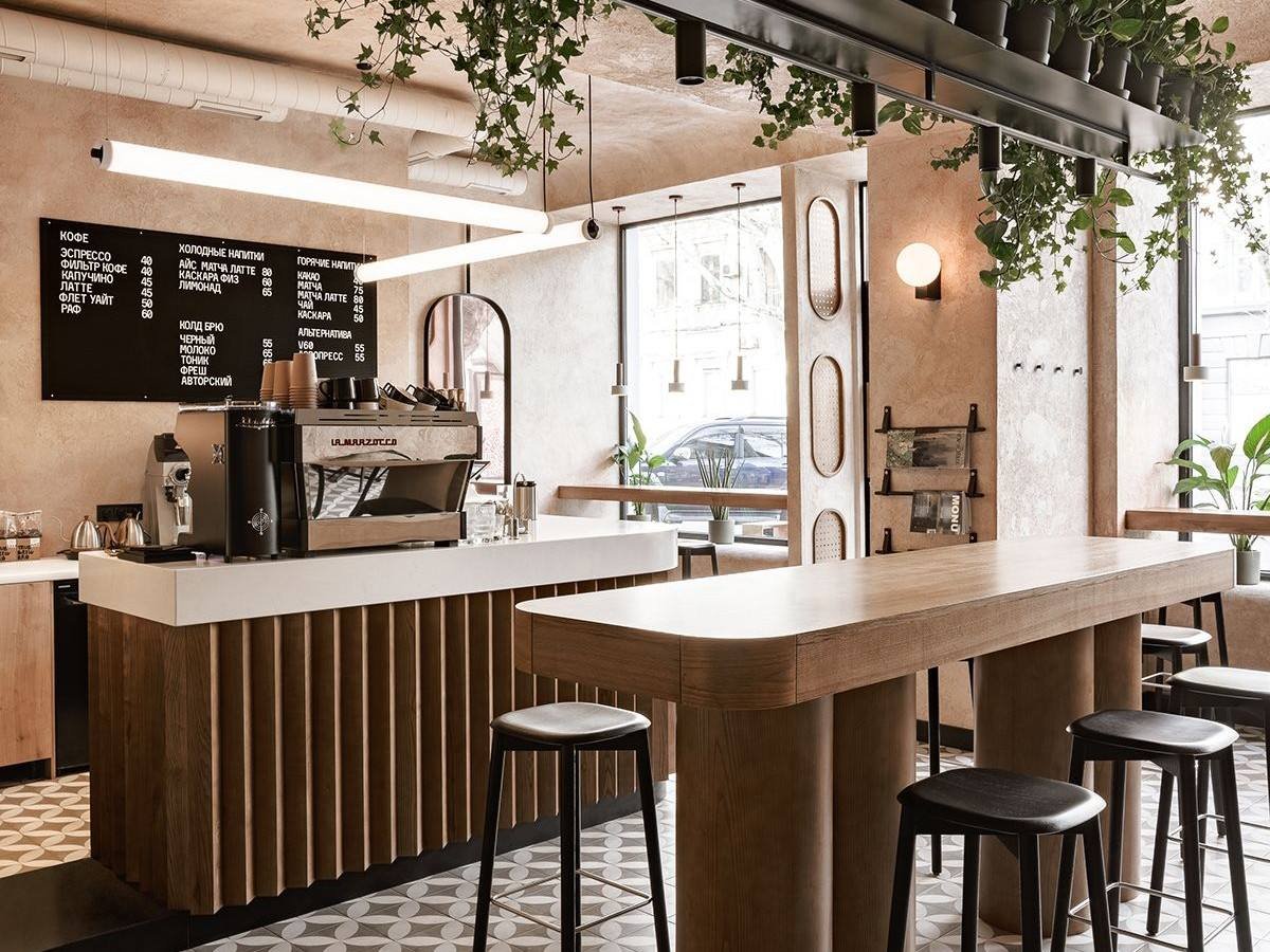 Modern cafe with warm lighting, feature wall and natural materials